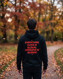 Person wearing the black Everything I Love Is Illegal Expensive Or Blonde hoodie, seen from behind