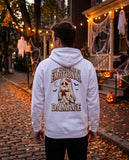 Person seen from behind in the white My Costume Is Emotional Damage hoodie