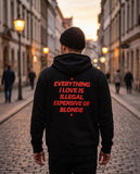 Person wearing the black Everything I Love Is Illegal Expensive Or Blonde zip hoodie, seen from behind