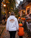 Person seen from behind in the white Hauntie hoodie