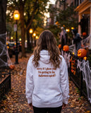 Person seen from behind in the white Sorry If I Ghost You hoodie