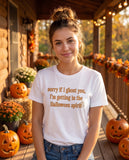 Person wearing the white Sorry If I Ghost You t-shirt