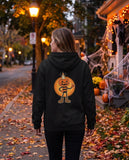 Person seen from behind in the black Pumpkin Candle Head hoodie