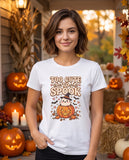 Person wearing the white Too Cute To Spook t-shirt