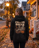 Person seen from behind in the black Coffin Break hoodie