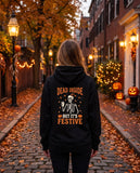 Person seen from behind in the black Dead Inside But It's Festive hoodie
