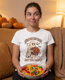 Person wearing the white Here For The Candy Not The People t-shirt