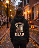 Person seen from behind in the black Social Battery Dead hoodie