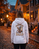 Person seen from behind in the white Social Battery Dead hoodie
