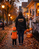 Person seen from behind in the black Hauntie hoodie