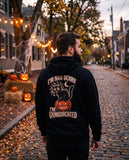 Person seen from behind in the black I'm Not Scary I'm Unmedicated hoodie