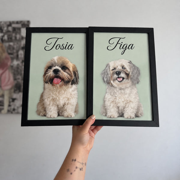 Two dog portrait posters with the names Tosia and Figa in black frames