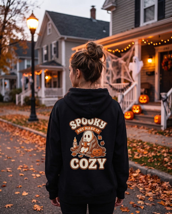 Person seen from behind in the black Spooky But Make It Cozy hoodie