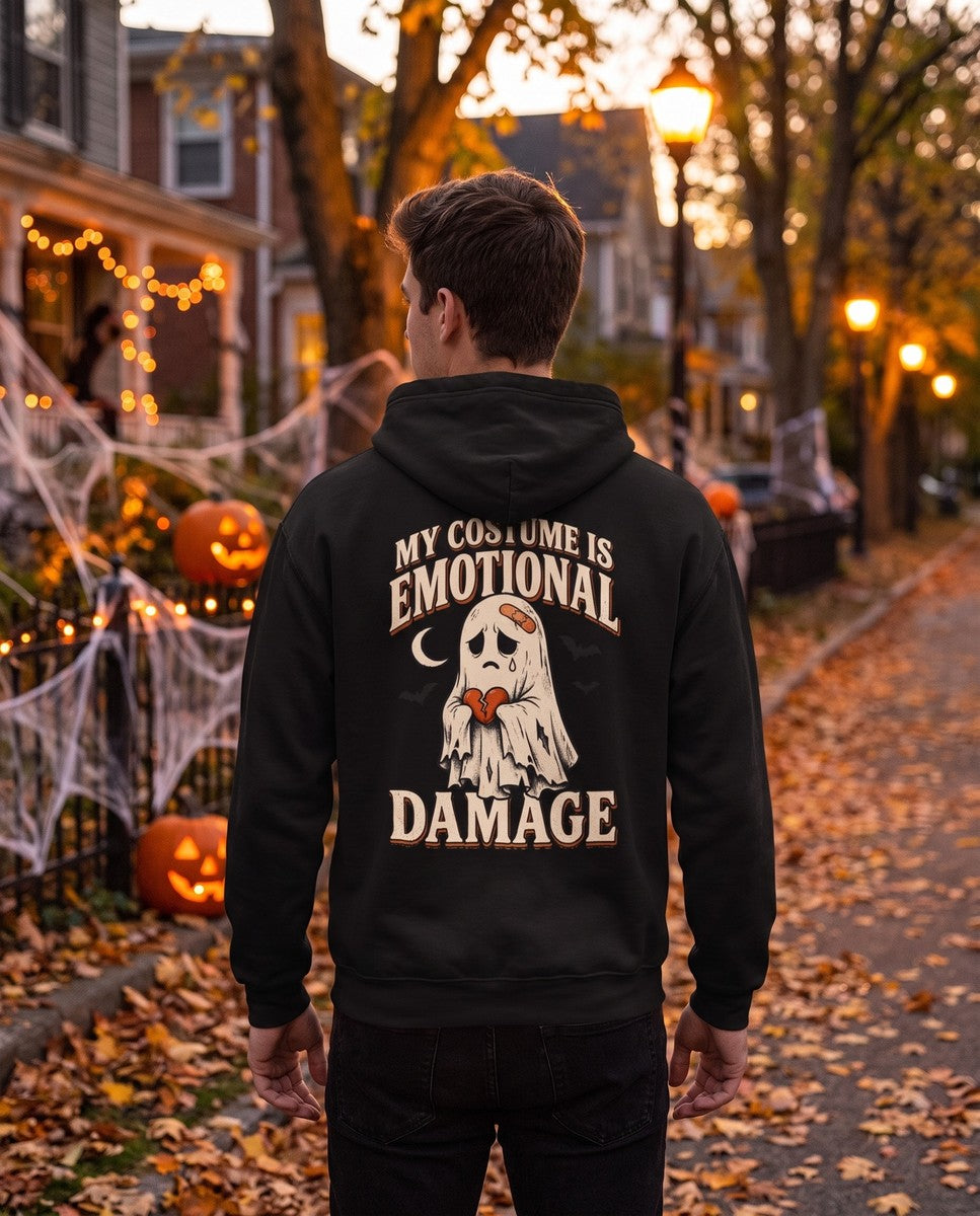 Person seen from behind in the black My Costume Is Emotional Damage hoodie