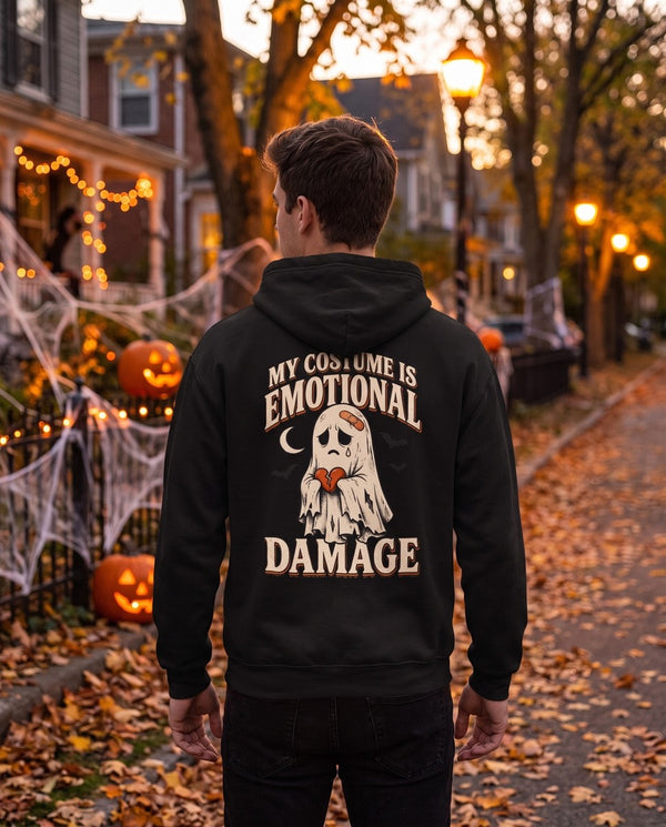 Person seen from behind in the black My Costume Is Emotional Damage hoodie