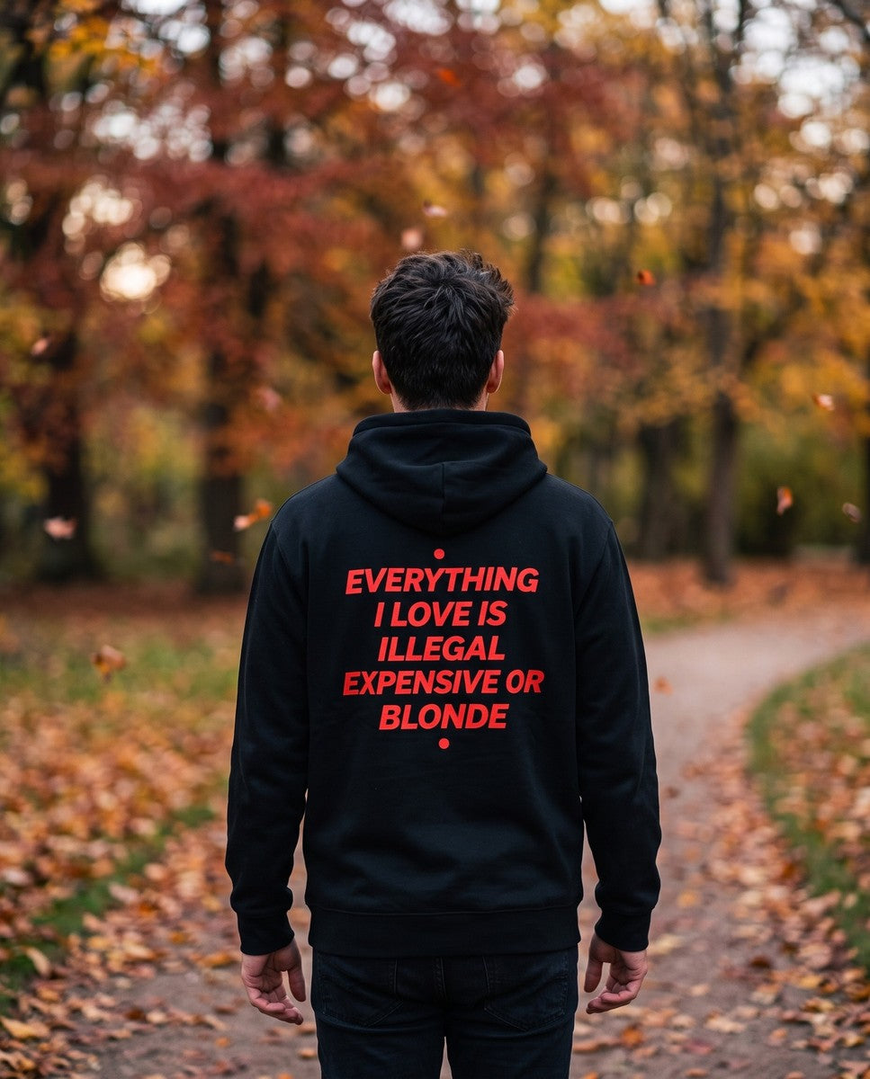 Person wearing the black Everything I Love Is Illegal Expensive Or Blonde hoodie, seen from behind