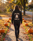 Person seen from behind in the black Cute Enough To Haunt You hoodie