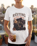 Person wearing the white Resting Witch Face t-shirt, seen from the front