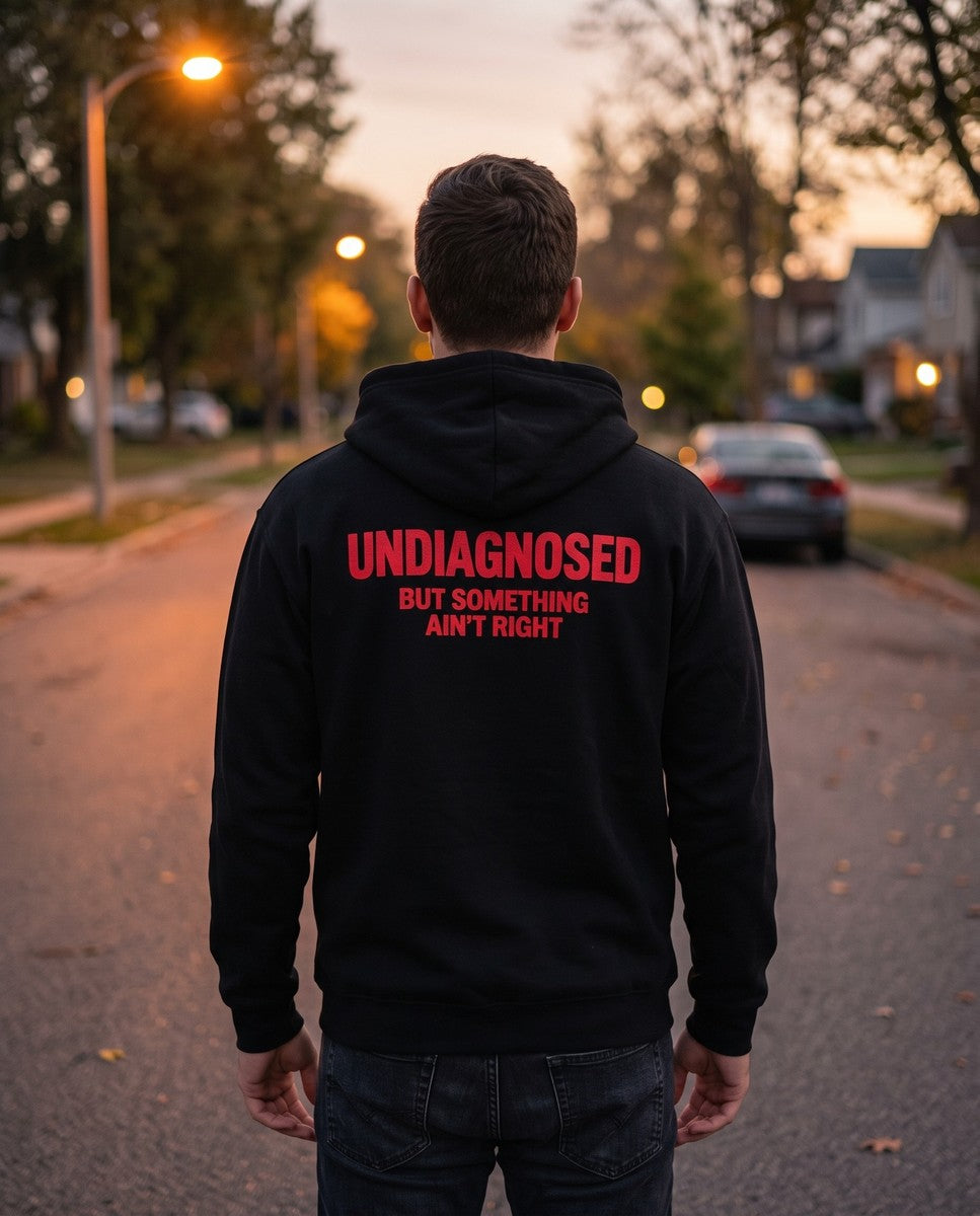 Person wearing the black Undiagnosed But Something Ain't Right zip hoodie, seen from behind