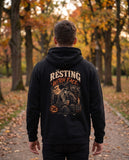 Person wearing the black Resting Witch Face hoodie, seen from behind