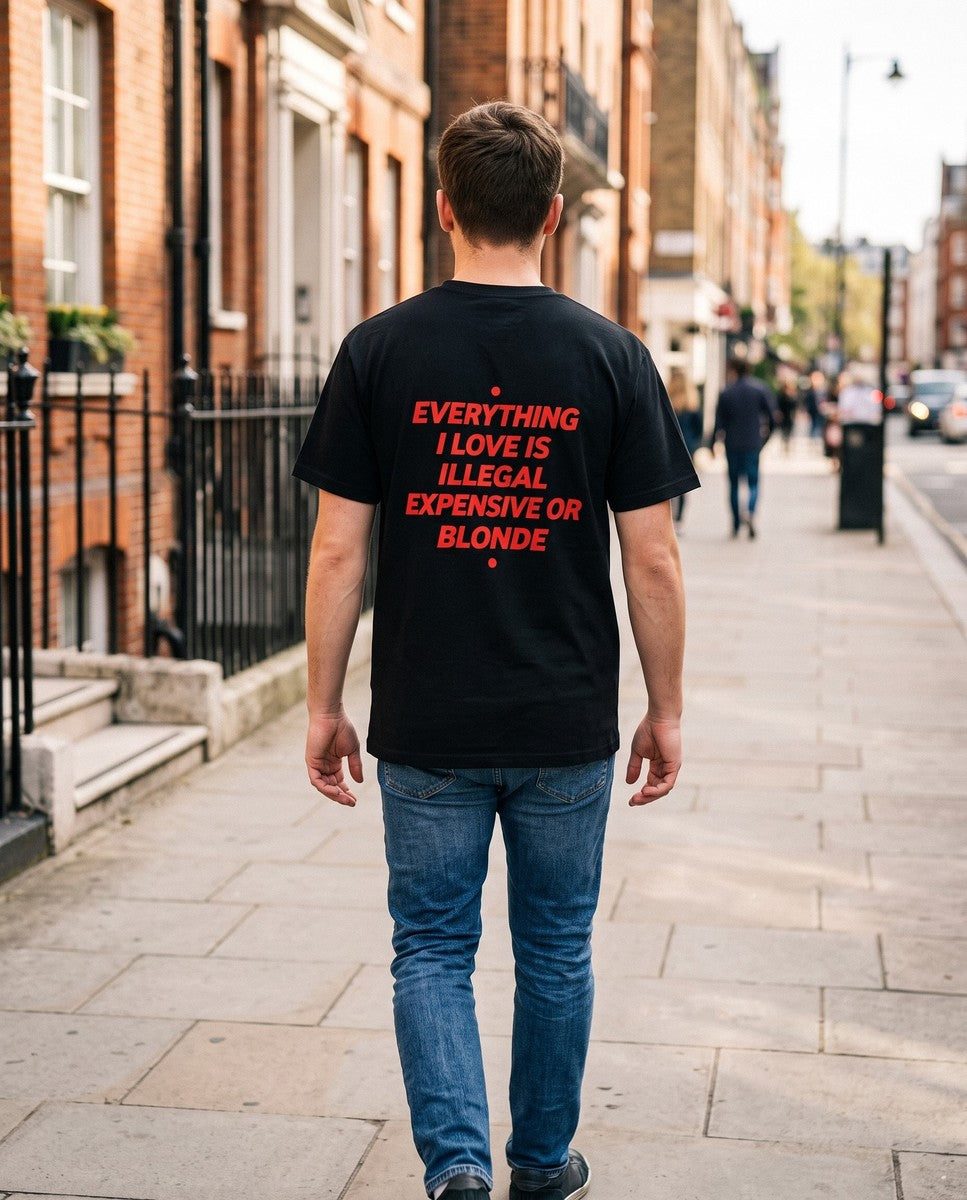 Person wearing the black Everything I Love Is Illegal Expensive Or Blonde t-shirt, seen from behind