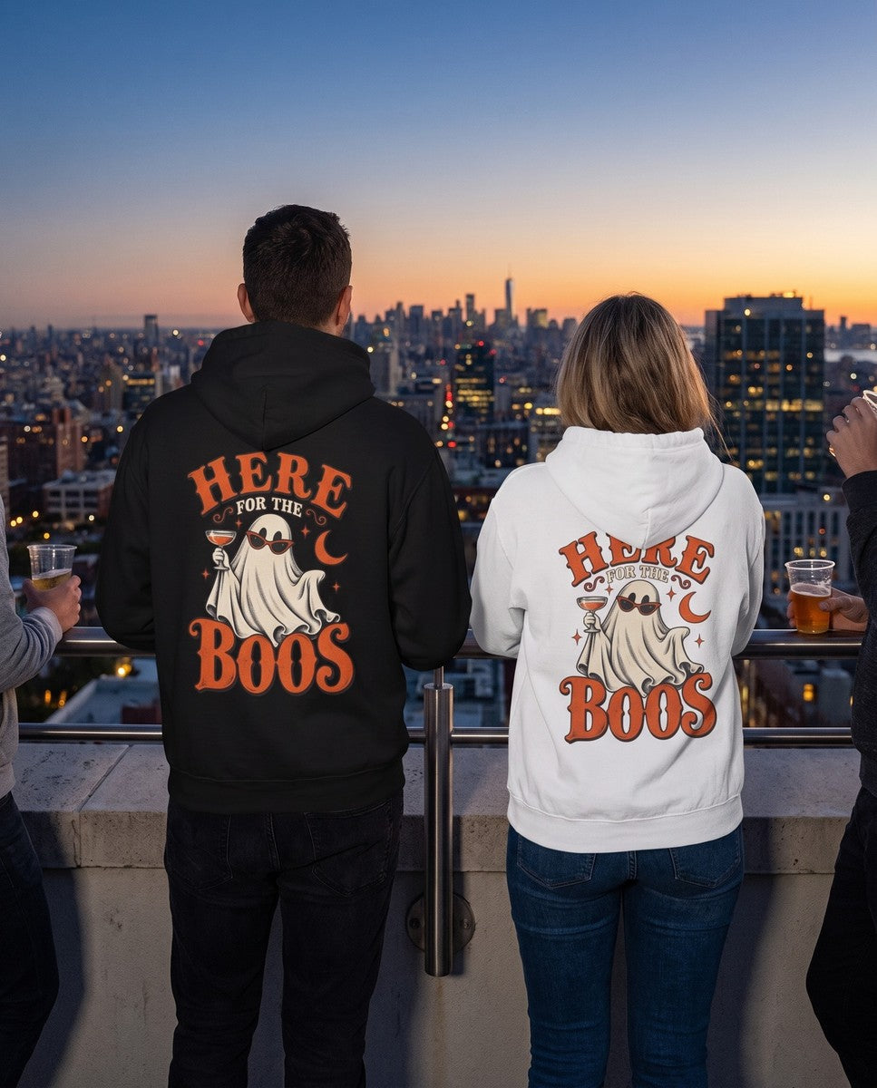 Two friends seen from behind in the black and white Here For The Boos hoodies