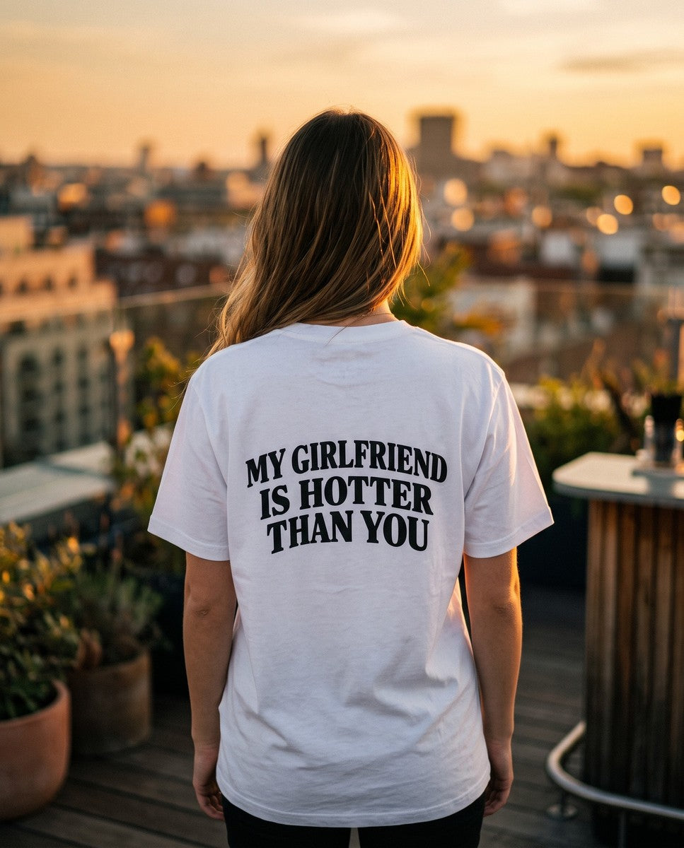 Person wearing the white My Girlfriend Is Hotter Than You t-shirt, seen from behind