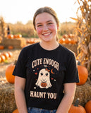 Person wearing the black Cute Enough To Haunt You t-shirt