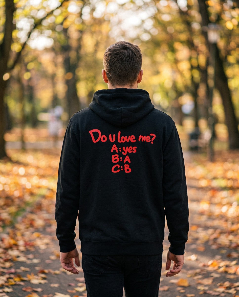 Person wearing the black Do U Love Me hoodie, seen from behind