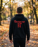 Person wearing the black Do U Love Me hoodie, seen from behind