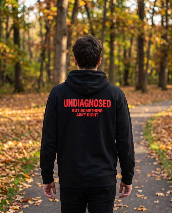Person wearing the black Undiagnosed But Something Ain't Right hoodie, seen from behind