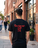 Person wearing the black Do U Love Me t-shirt, seen from behind