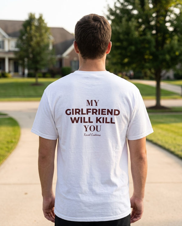 Man seen from behind wearing the white My Girlfriend Will Kill You t-shirt