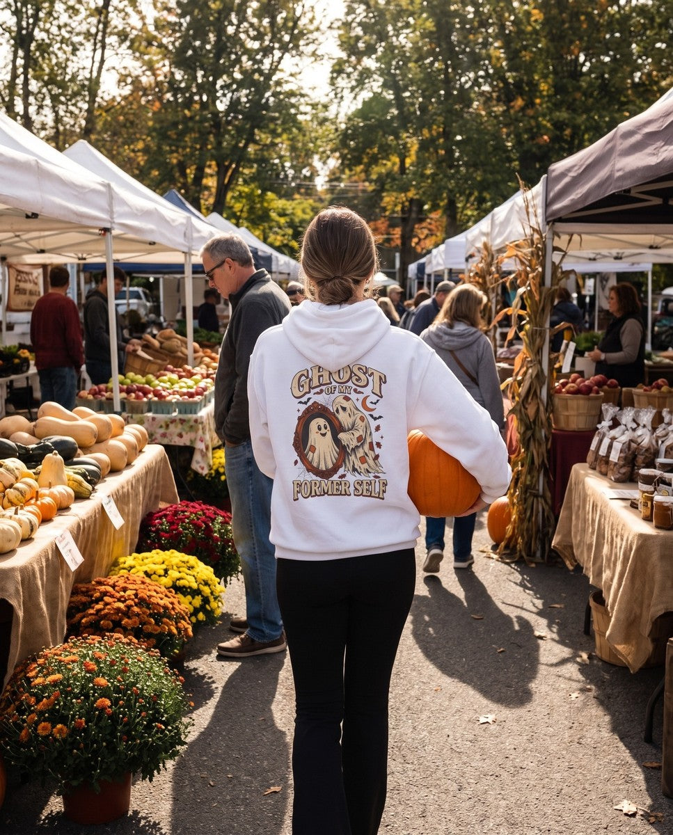 Person seen from behind in the white Ghost Of My Former Self hoodie