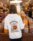 Person seen from behind in the white Here For The Candy Not The People hoodie