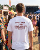 Man seen from behind wearing the white Don't Talk To Me I Have A Crazy Girlfriend t-shirt