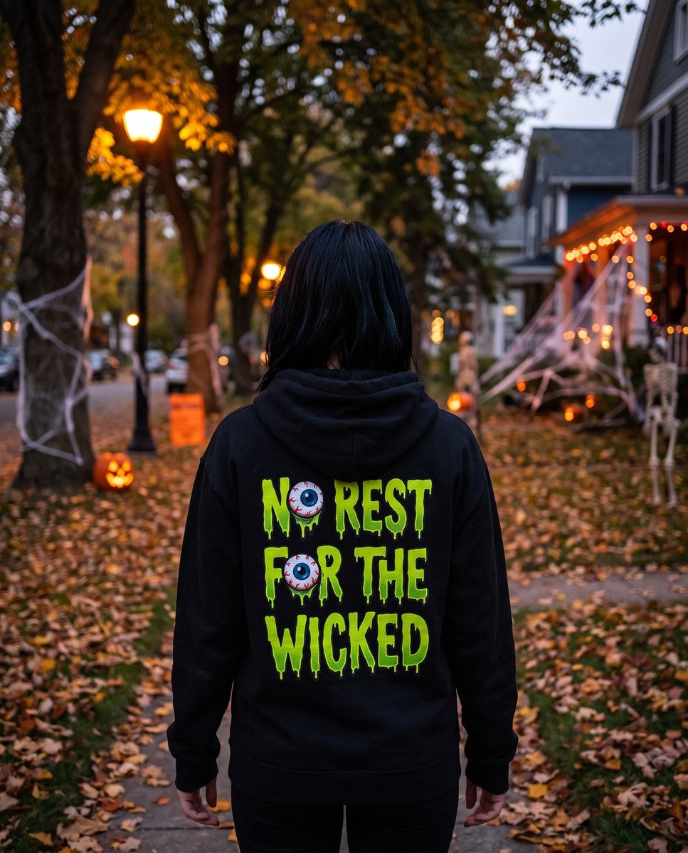 Person seen from behind in the black No Rest For The Wicked hoodie