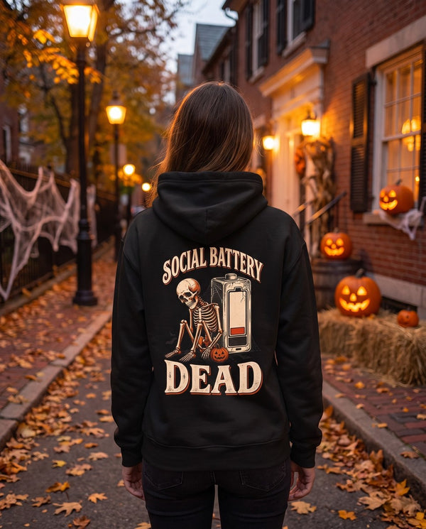 Person seen from behind in the black Social Battery Dead hoodie