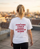 Person wearing the white Everything I Love Is Illegal Expensive Or Blonde t-shirt, seen from behind