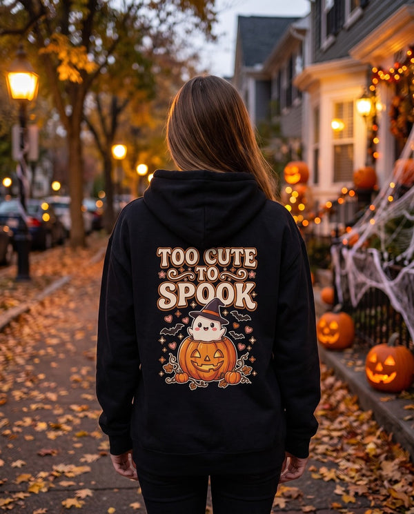Person seen from behind in the black Too Cute To Spook hoodie