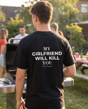 Man seen from behind wearing the black My Girlfriend Will Kill You t-shirt