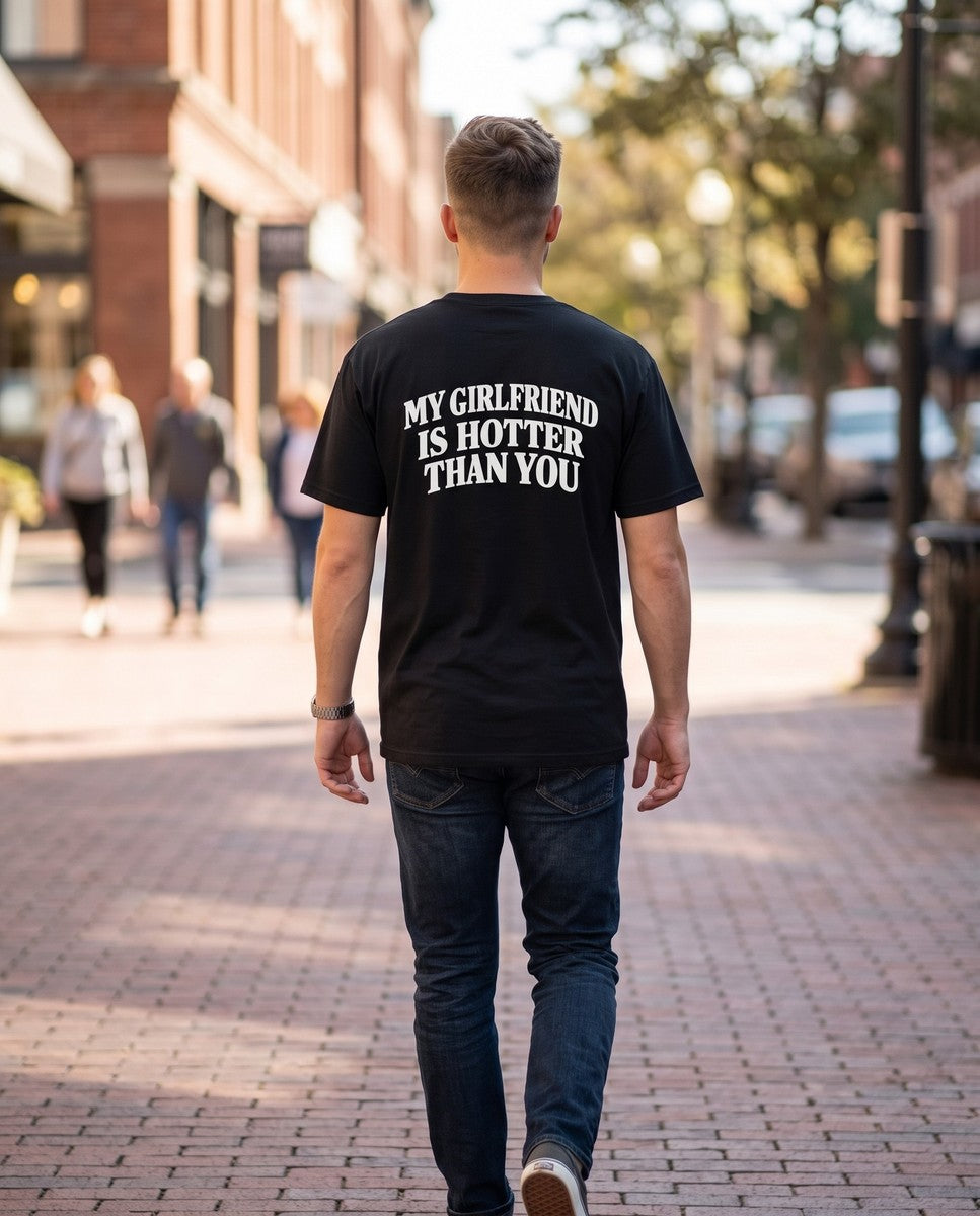 Person wearing the black My Girlfriend Is Hotter Than You t-shirt, seen from behind