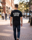 Person wearing the black My Girlfriend Is Hotter Than You t-shirt, seen from behind