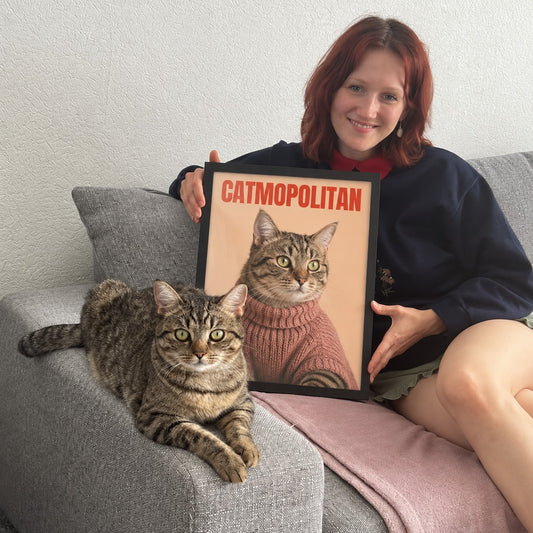 CATMOPOLITAN poster with the same cat on the couch beside it