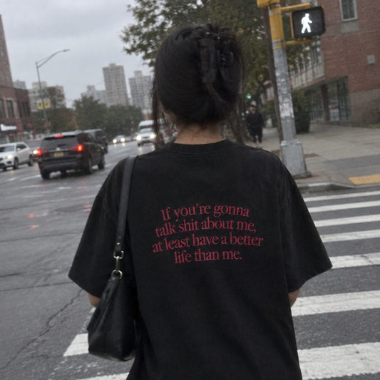 Black T-shirt with red If you're gonna talk shit about me back print, on the street