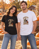 Couple at a pumpkin patch wearing the black and white Scariest Thing Is My Bank Account tees